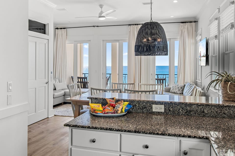 Remodeled Kitchen with granite countertops, stainless appliances - cook delicious meals and dine while overlooking the Gulf of Mexico!