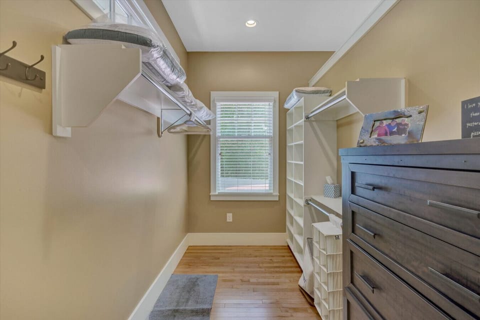 Plenty of space for your clothes in our walk in closet attached to the primary bedroom