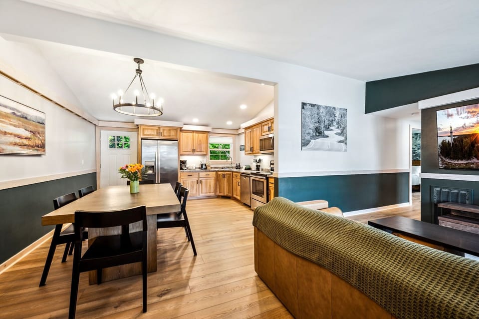 View of the open concept kitchen, dining, and living room areas.