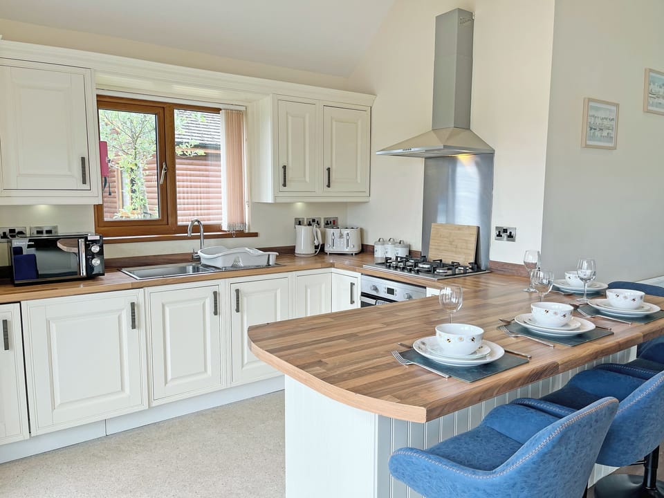 Kitchen area | Jasmine Lodge, Fitling
