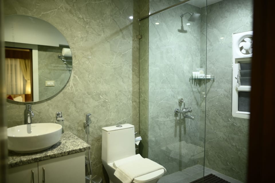 Family Suite, City View | Bathroom | Shower, hair dryer, slippers, bidet