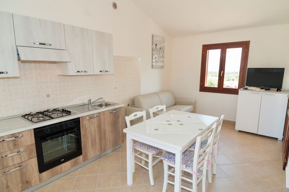 Apartment | Living area | 24-inch flat-screen TV with satellite channels