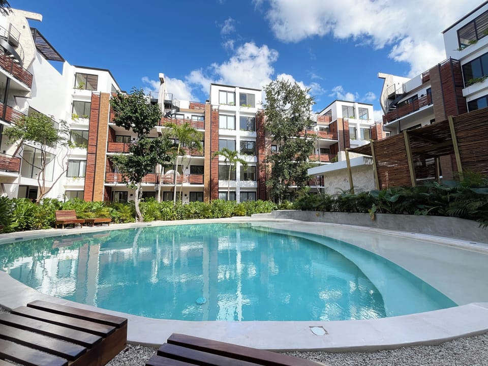 Picture yourself soaking up the sun and cooling off in the communal pool.
