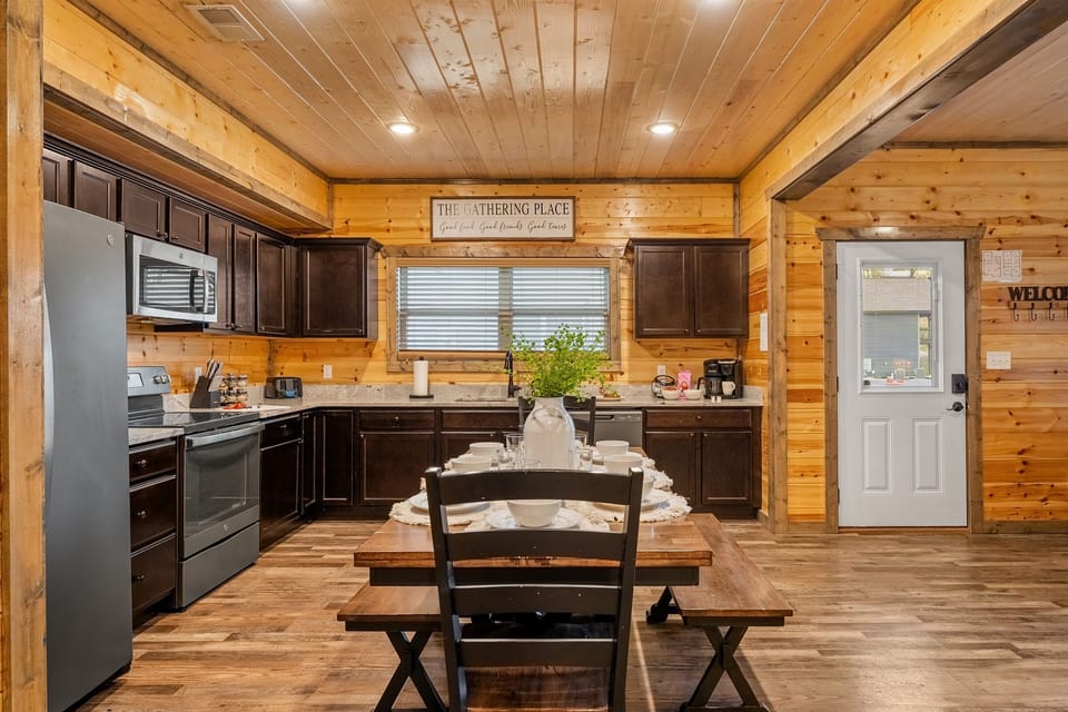 Our kitchen boasts new cabinets, granite countertops, and stainless steel appliances.