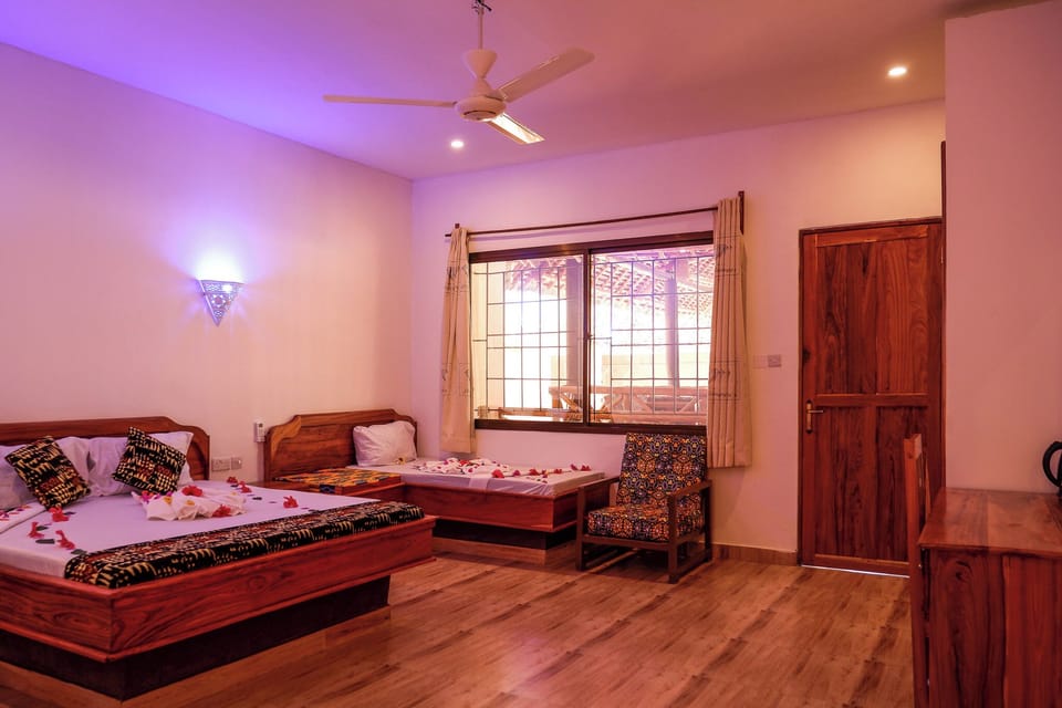 Deluxe Quadruple Room, Patio, Pool View | In-room safe, desk, laptop workspace, free WiFi