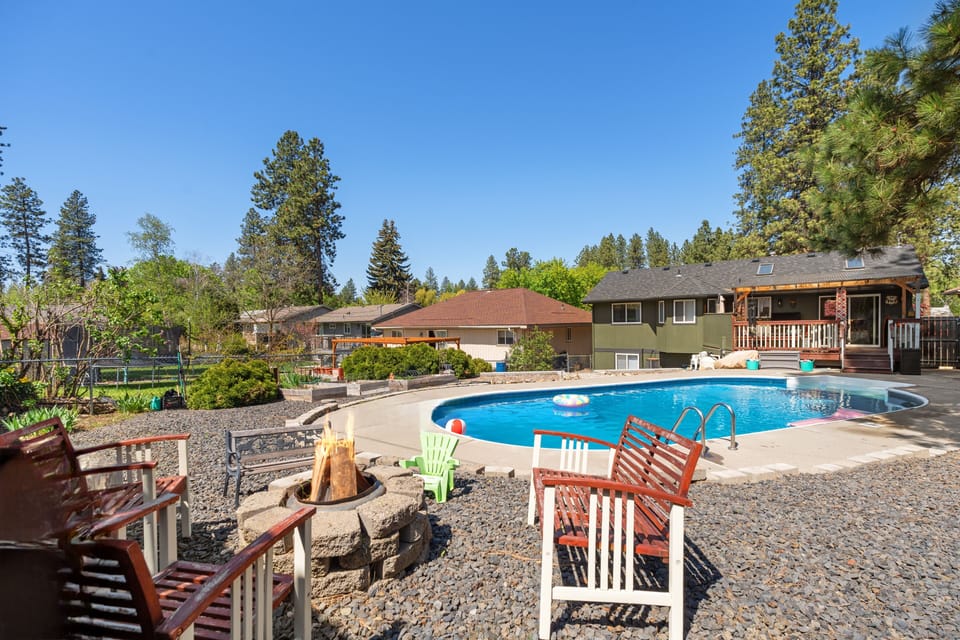 The backyard summer firepit is ideal for cozy nights by the pool.