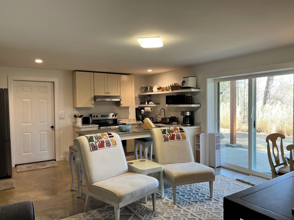 View from bedroom into kitchen and living area