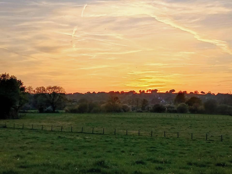 Sunset view from seating area. | Rosie - Tanyrallt Holidays Lets, Llanybydder, near Lampeter
