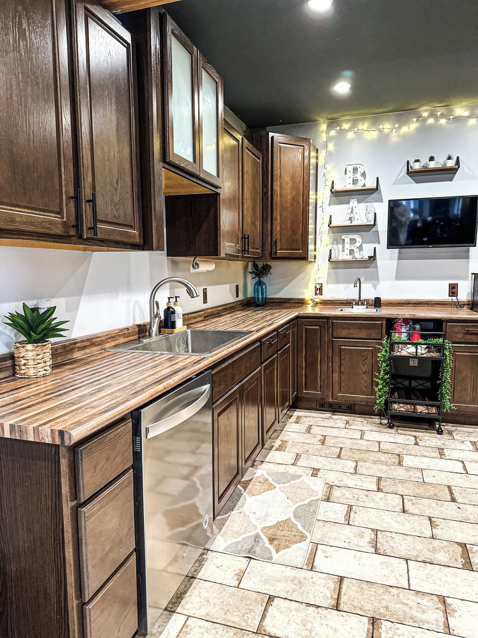 Fully Stocked Kitchen – Enjoy cooking in this spacious kitchen with modern appliances, warm wood finishes, and thoughtful décor. Everything you need for a home-cooked meal!
