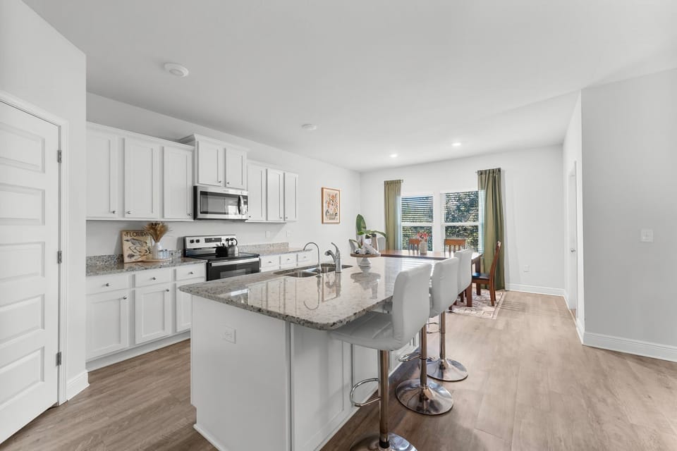 Fully stocked kitchen with modern appliances and plenty of space to cook!