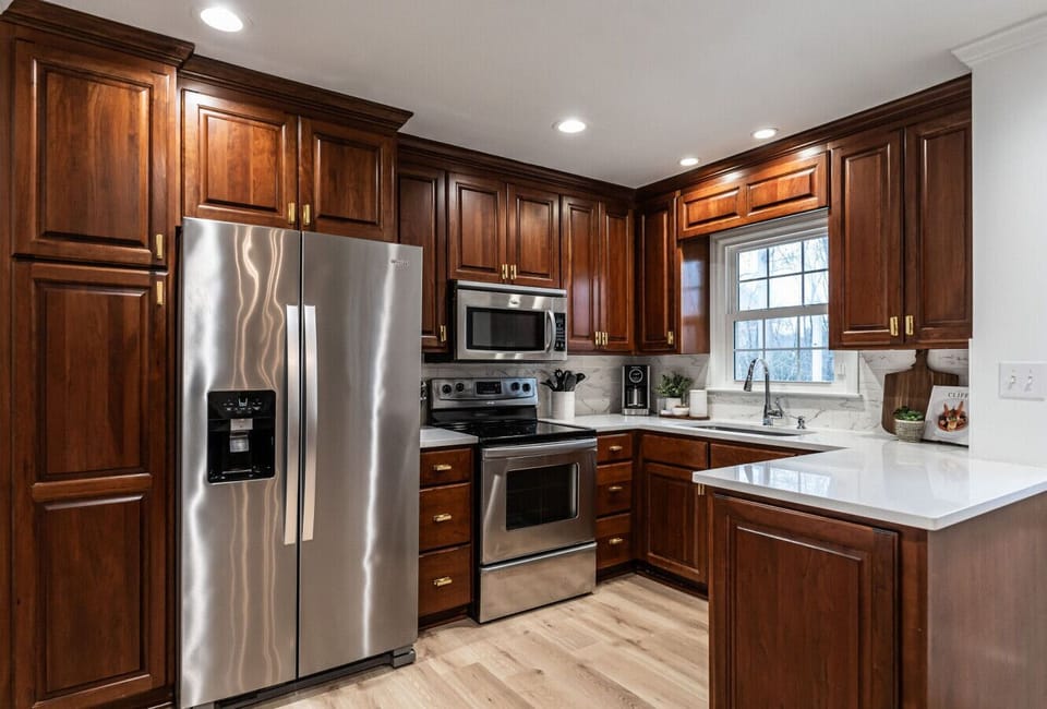A bright, well-equipped kitchen with generous counter space and a view out to the backyard