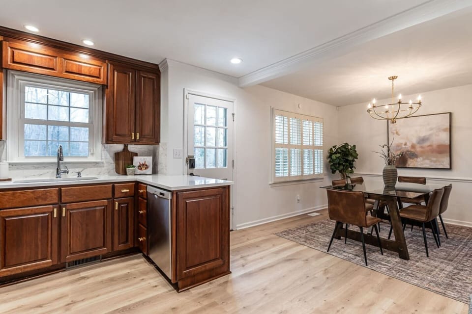 An open flow between the kitchen and dining area keeps everyone part of the conversation and makes entertaining easy and effortless