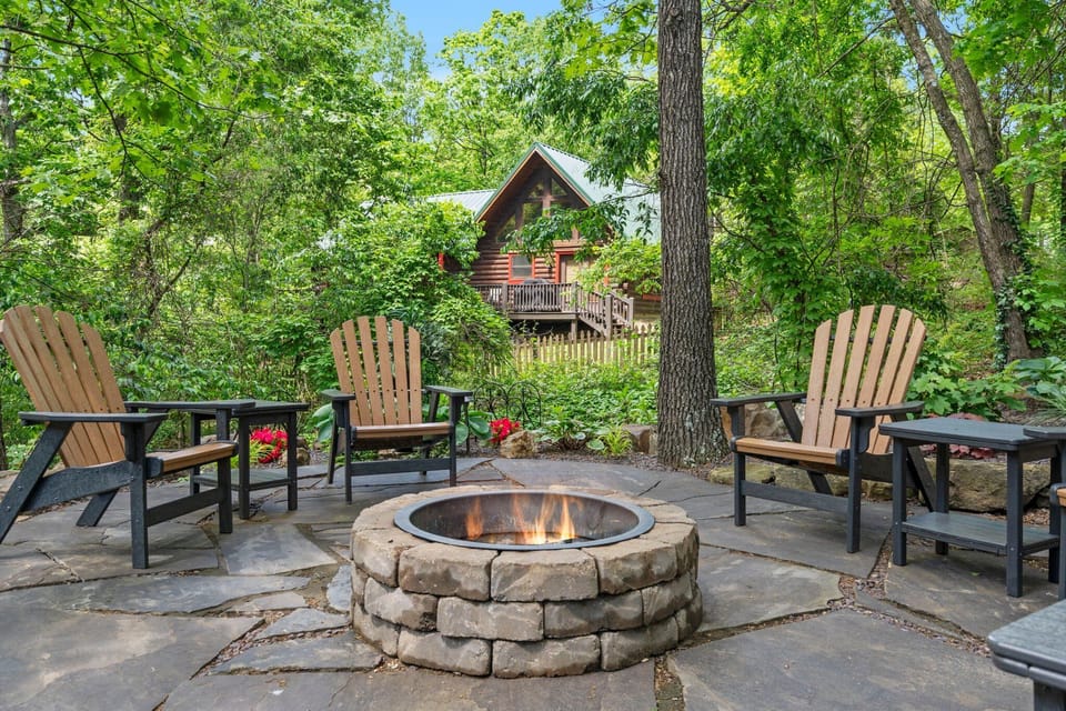 Gather 'round the fire pit 🔥 for stories, s'mores, and starlit laughter — all tucked into the peaceful wooded charm of your private cabin escape.