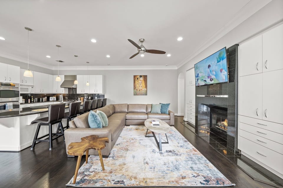 Open-concept space connects dining area w/seating for 8 & 6 kitchen bar stools.