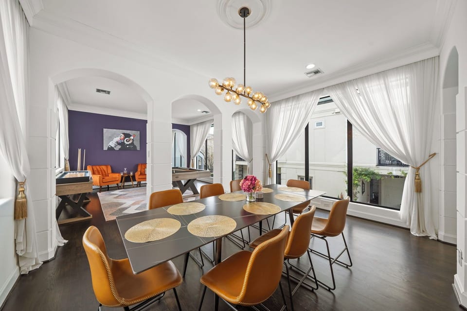 Dining open to kitchen, living room, & game room this space full w/natural light