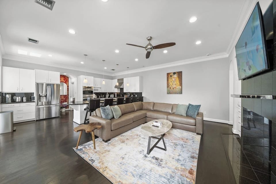 Gather in style w/a luxurious spacious leather sectional, fireplace & 65” TV. Open-concept space seamlessly connects to the dining area w/seating for 8 and kitchen bar w/6 stools. Selection of board games add a fun touch to this welcoming retreat!