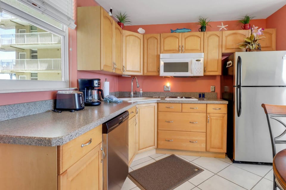 The kitchen has a cooktop (no oven,) toaster oven, microwave, refrigerator/freezer and dishwasher; basic cookware and dinnerware are provided.