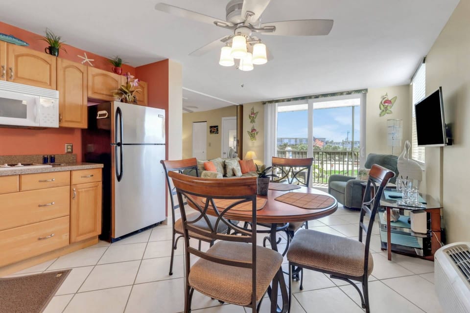 The open kitchen has a table for 4 - great for in-room meals or a friendly game of cards.