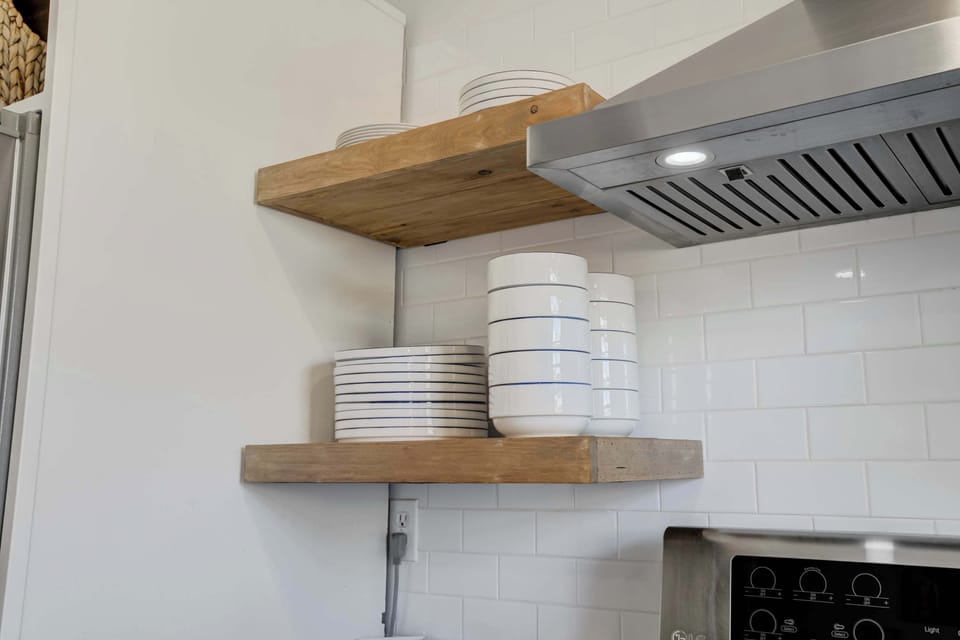 Open shelving adds a stylish touch while keeping essentials within easy reach for your meals and gatherings.




