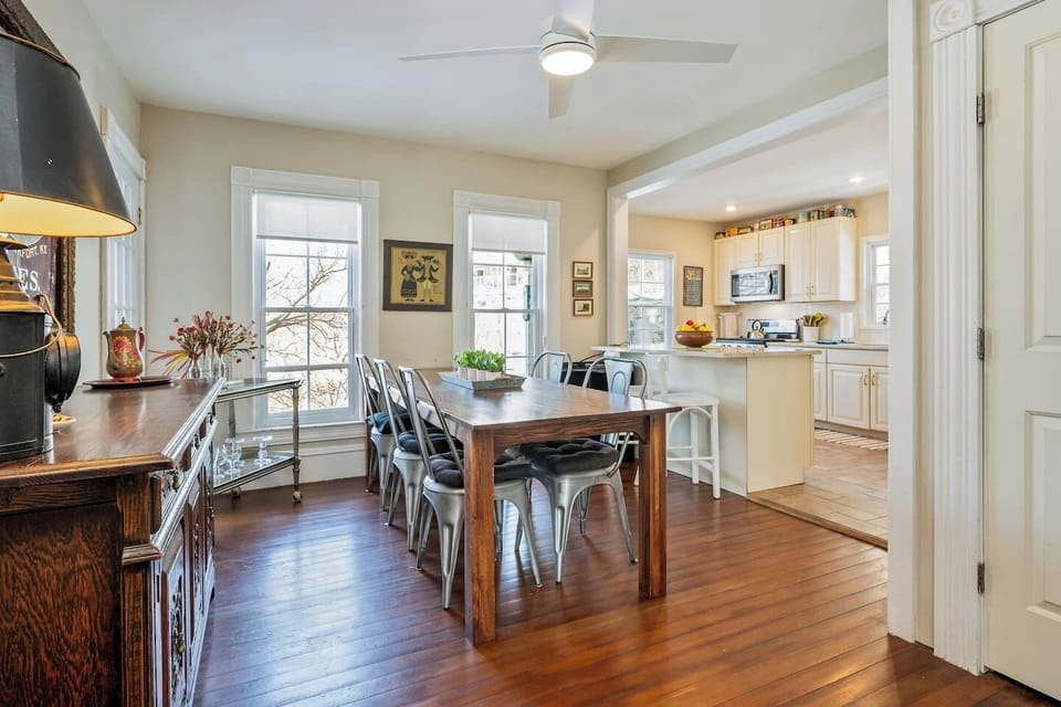 Gather around the large farmhouse-style table in this bright dining area, steps away from the open kitchen. Perfect for family meals and entertaining!