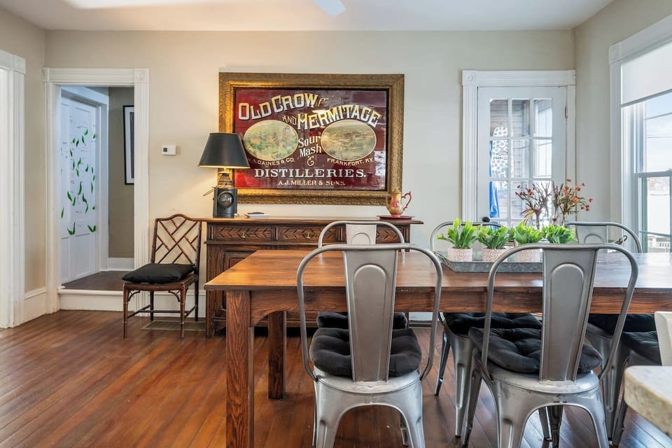 A warm and inviting dining area featuring antique furnishings, perfect for creating lasting memories with family and friends.