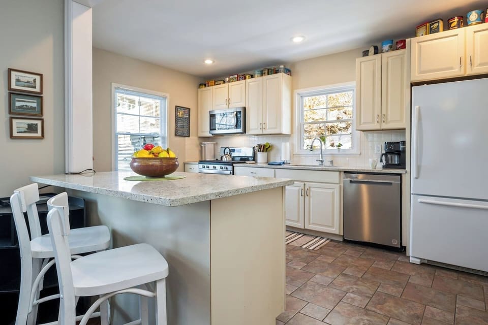 Start your day at the breakfast bar in this open-concept kitchen, designed for comfort and convenience.