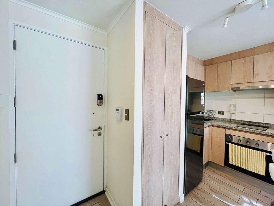 Entryway w/ secure door access & seamless flow into the kitchen area.