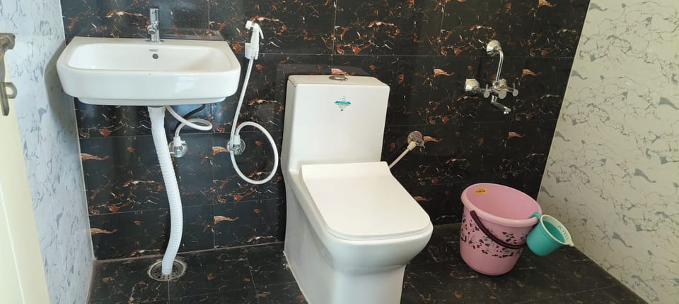 Economy Double Room, City View | Bathroom | Shower, rainfall showerhead, towels, soap