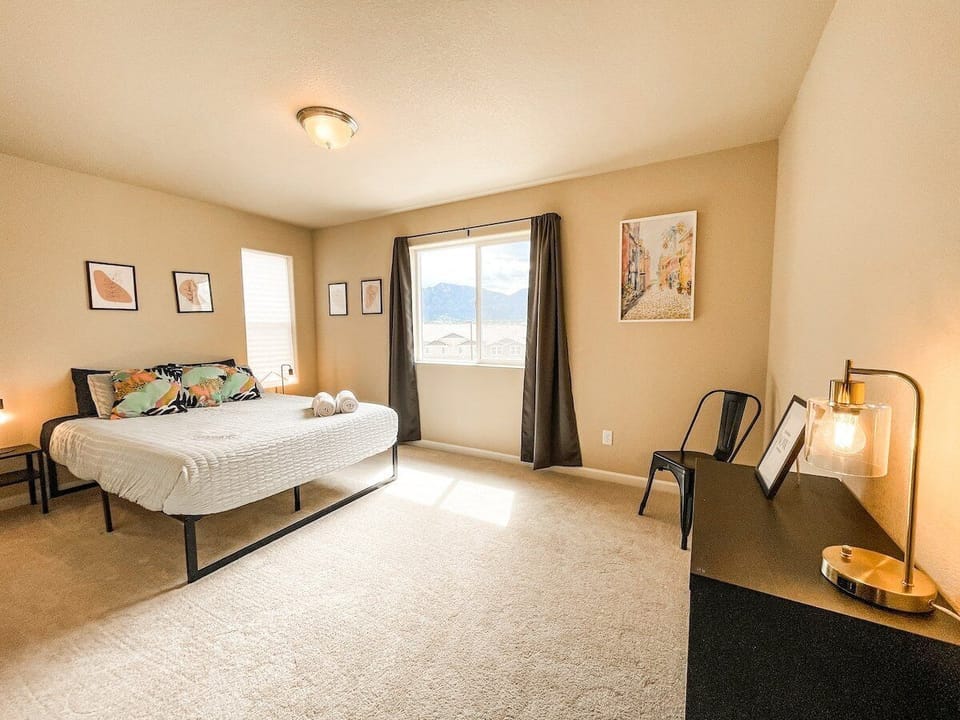 The second bedroom offers a cozy queen bed.