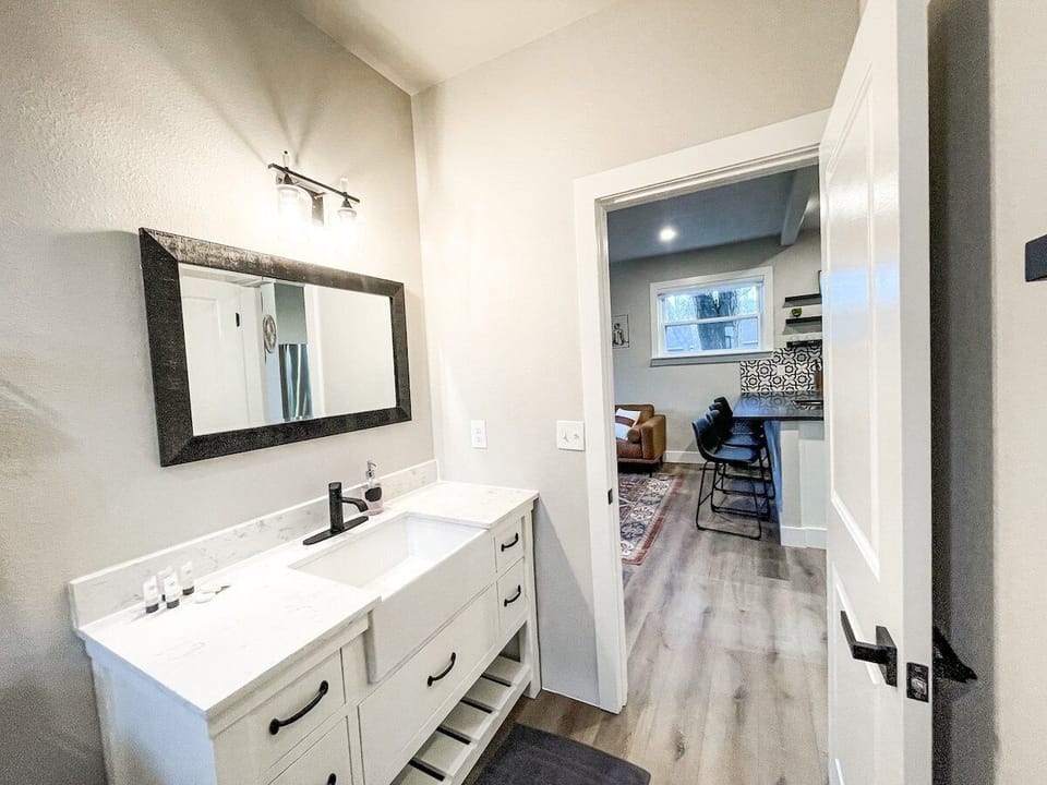 The bathroom is stocked with the essentials, like towels, toilet paper, shampoo and conditioner