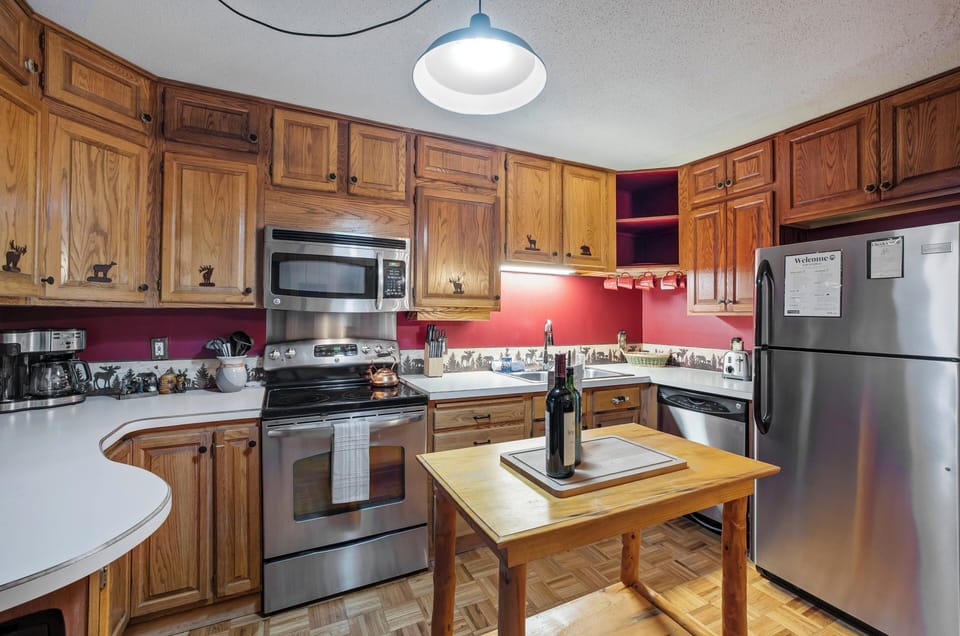 The fully equipped kitchen and dining area make gathering for meals easy after a day of exploring.