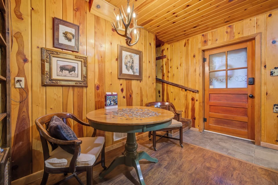 Guests can relax on the leather couches, enjoy the reading nook and electric fireplace, or gather around the game table for puzzles and board games.