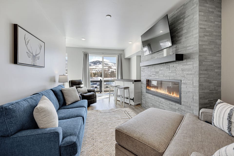 Living Room with sleeper sofa, 55" smart tv & gas fireplace