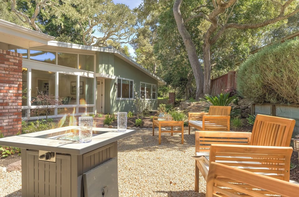The Backyard has a Large Patio Area with a Fire-Pit