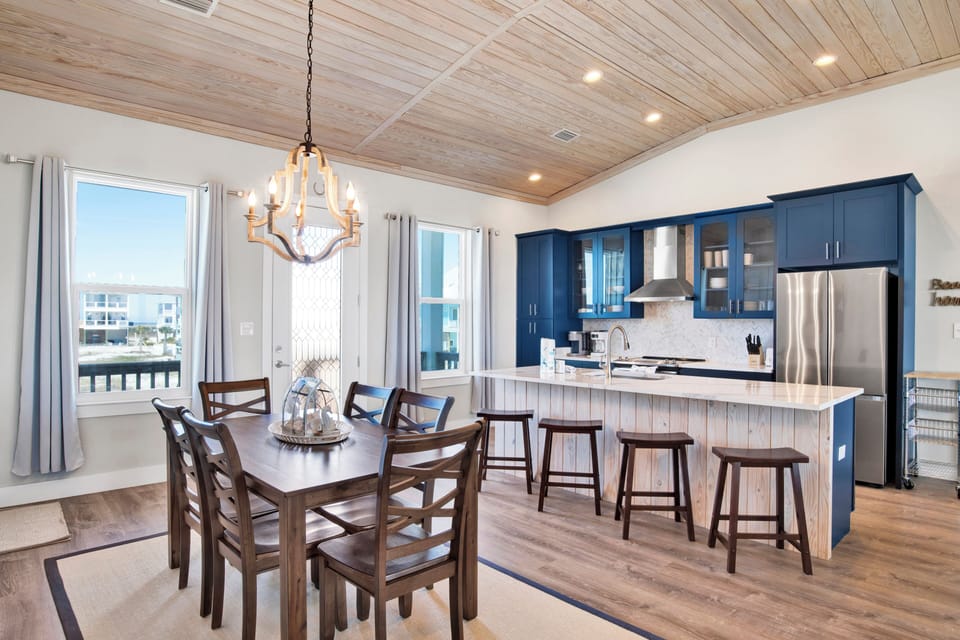 Seating for 6 at the dining table with additional seating at the bar
