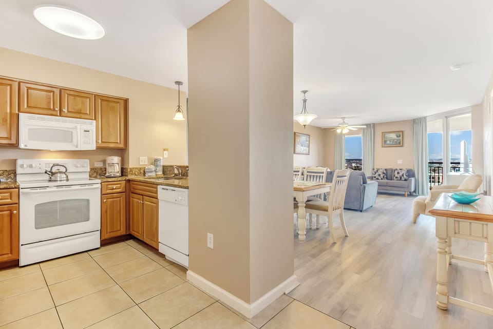 Your spacious kitchen features all the essentials for preparing meals, while the open layout flows beautifully into comfortable living and dining spaces.