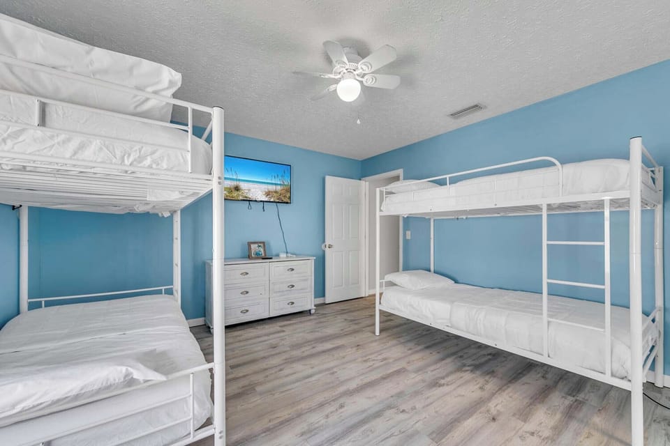 Bunk bedroom with flat-screen TV