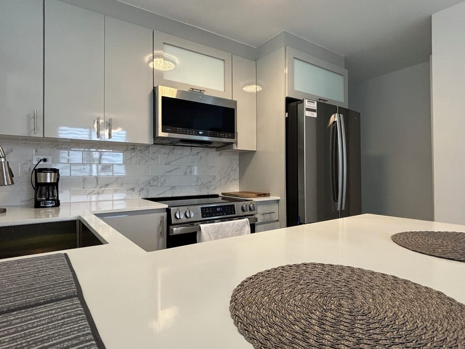Kitchen features full size new appliances