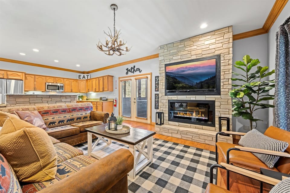 Loads of seating around the TV and fireplace. Couch pulls out into a bed!