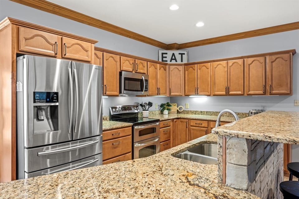 Kitchen with stainless steel appliances.