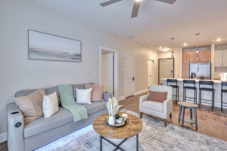 Relax in this stylish and cozy living area with chic decor, and soft lighting. Perfect for unwinding after a day of exploring.