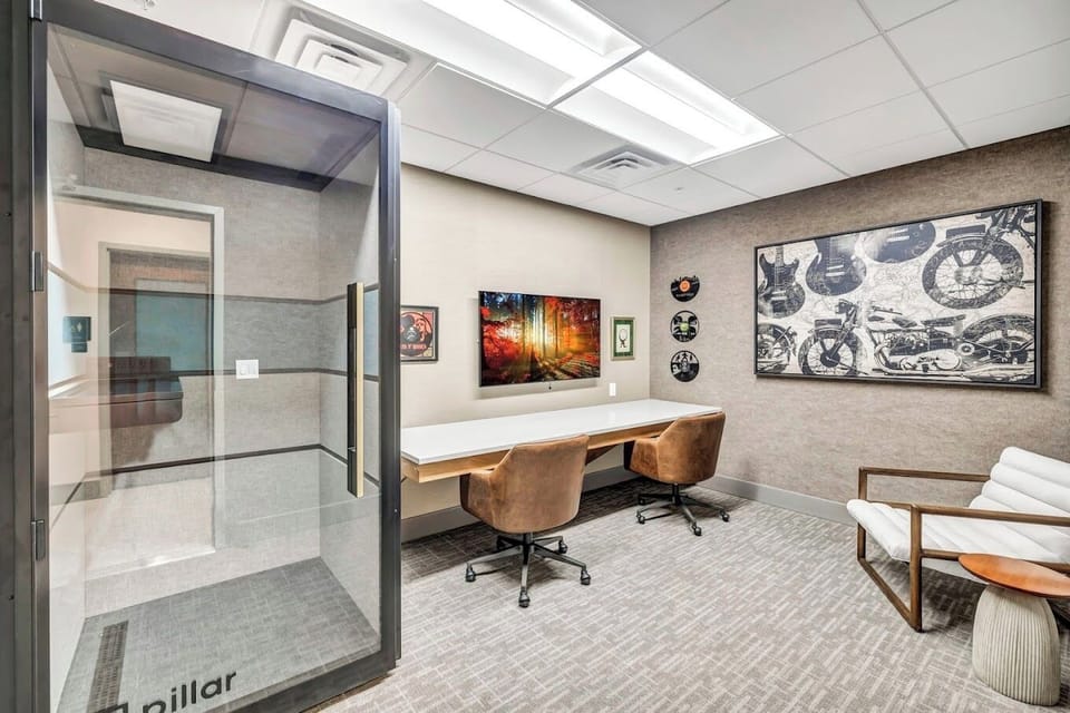 Unleash your creativity in a spacious music recording room, designed to bring your ideas to life and capture every note with ease.