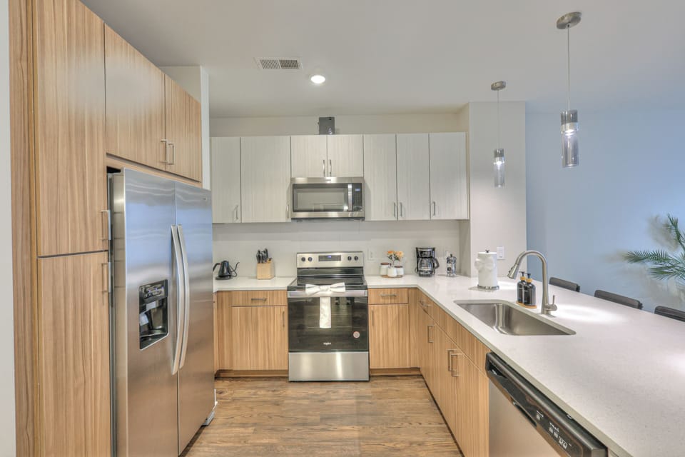 Cook in style! This modern kitchen features stainless steel appliances, and gleaming finishes.