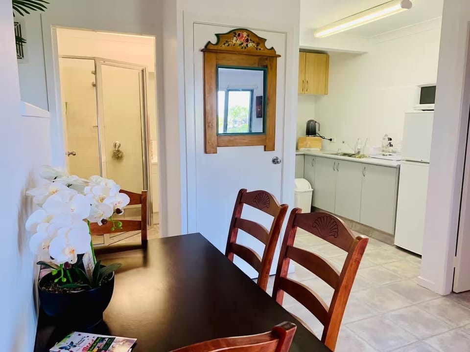 Dinning table with Kitchen in background