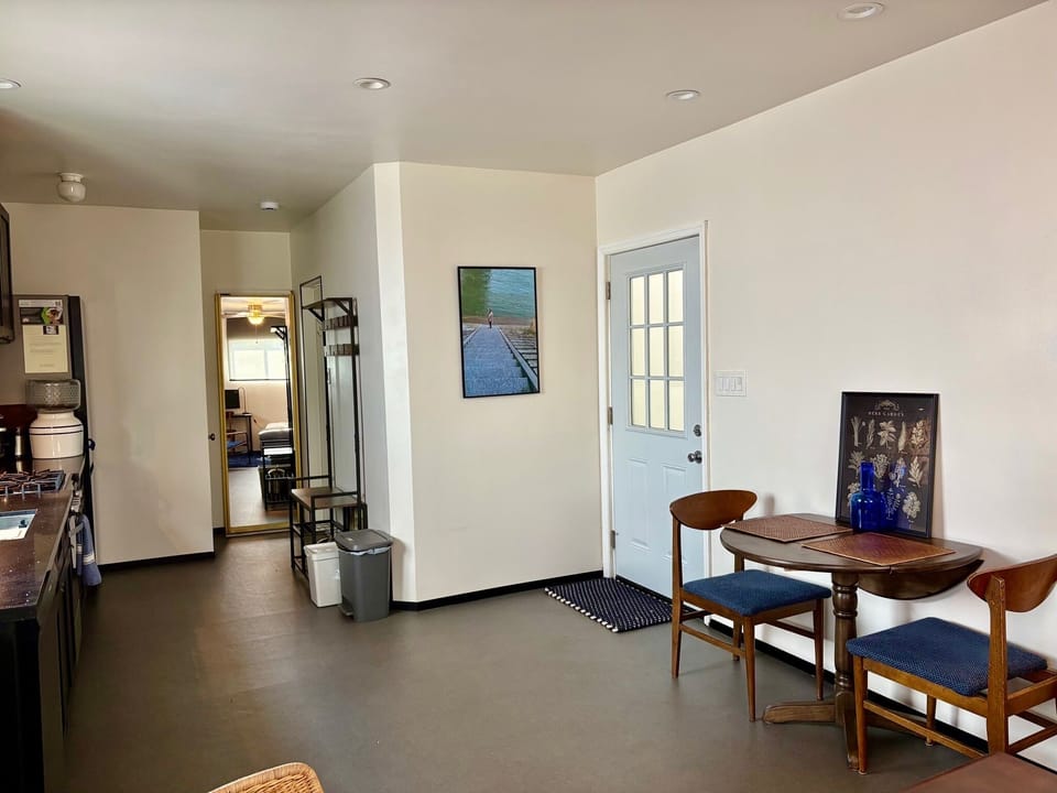entrance door to open kitchen / dining area.  36" dining table.
