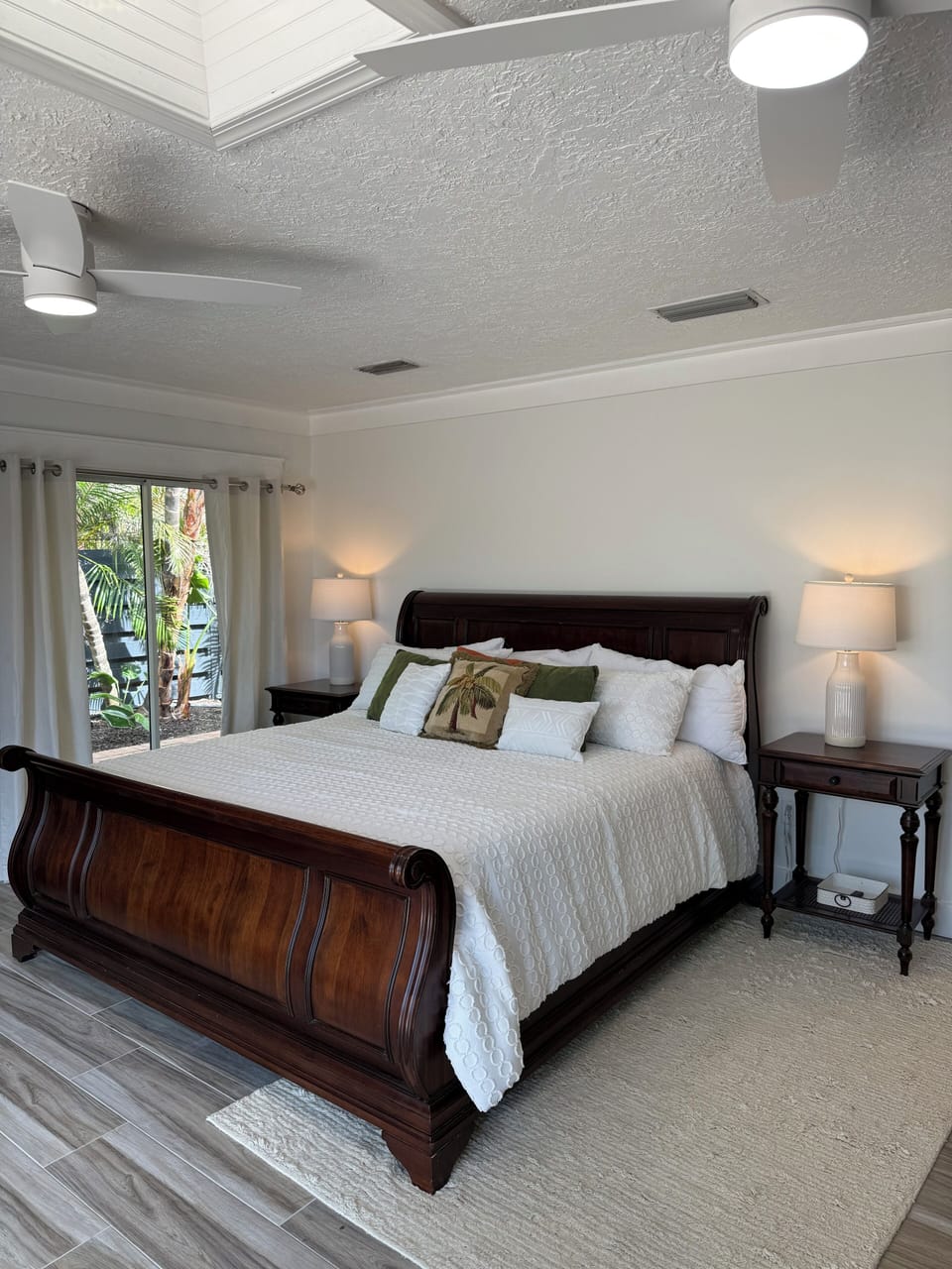 Spacious master bedroom with direct access to pool through sliding glass doors”