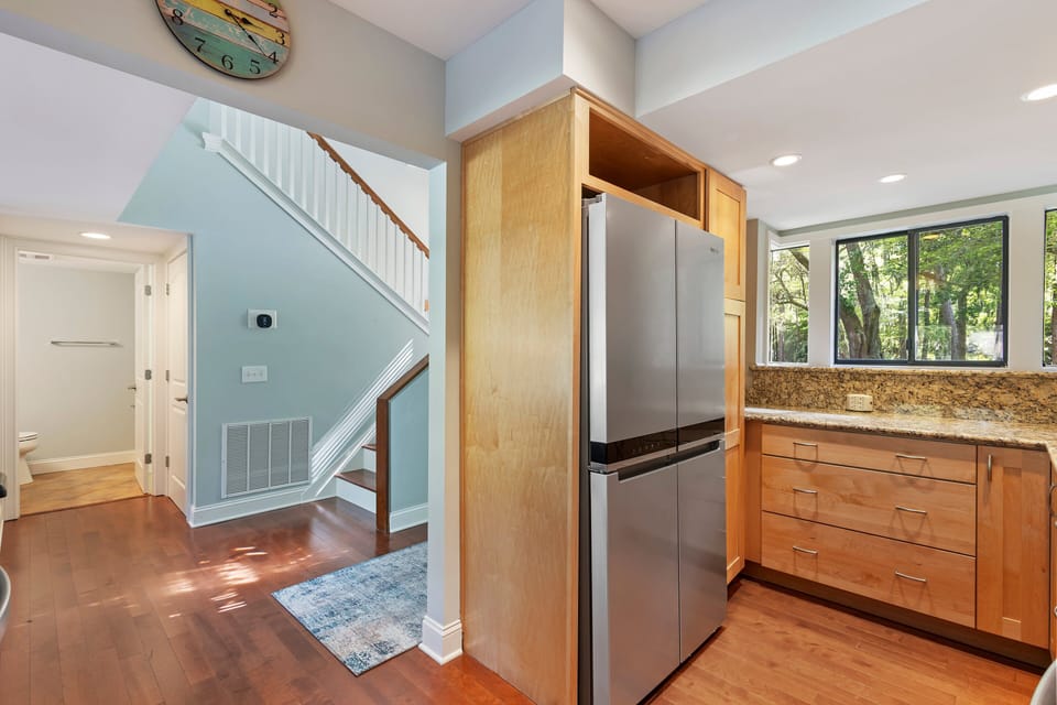Redesigned kitchen with granite countertops, new cabinets and stainless-steel appliances.