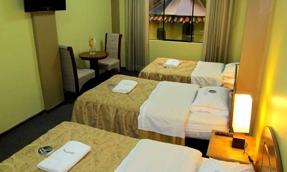 Classic Quadruple Room | Down comforters, desk, laptop workspace, free WiFi