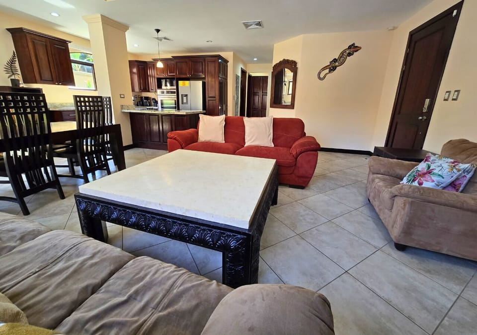 Spacious living room with plush seating and large table for meals or games.