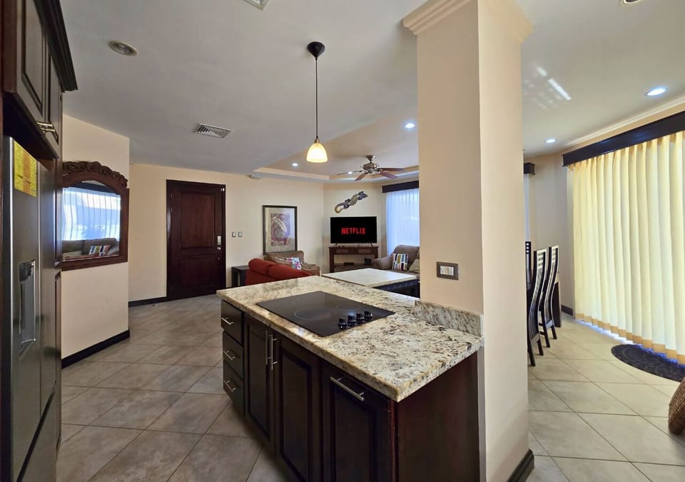 Cook and stay part of the fun with open kitchen to living and dining areas.